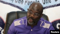 President-elect George Weah of Coalition for Democratic Change (CDC) attends a news conference at party headquarters, after the announcement of the presidential election results, in Monrovia, Liberia, Dec. 30, 2017. 
