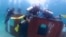 A shipping container was dropped in the coast of Sihanoukville to create artificial coral reefs. (Courtesy of National Committee For Maritime Security)