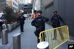 Police block off a sidewalk while responding to a report of an explosion near Times Square on Dec. 11, 2017, in New York.