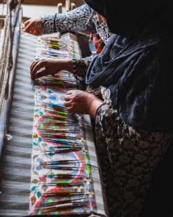 An artisan weaves Pashmina fabric in Srinagar. (Me&K photo)