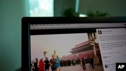 A computer screen displays the social media posting by Mark Zuckerberg on Facebook in Beijing, China, Friday, March 18, 2016.