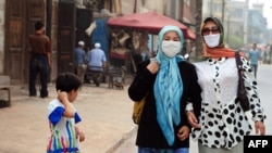 Uyg'ur musulmon ayollari, Shinjon, 2008-yil, 14-iyun