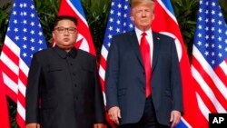 Кім Чен Ин (л) і Дональд Трамп