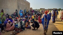 FILE - Sudanese refugees gather as Doctors Without Borders teams assist the war-wounded from West Darfur, Sudan, in Adre hospital, Chad, June 16, 2023. (Doctors Without Borders via REUTERS)