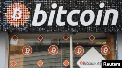 FILE PHOTO: A Bitcoin digital currency ATM shop is seen in Marseille, France, February 7, 2021. REUTERS/Eric Gaillard/File Photo