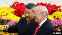 U.S. President Donald Trump and China's President Xi Jinping attend a welcoming ceremony in Beijing, Nov. 9, 2017. 