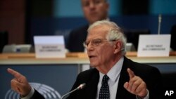 FILE - Nominated European foreign policy chief Josep Borrell answers questions during his hearing at the European Parliament in Brussels, Oct. 7, 2019.