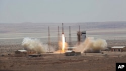 This photo, released by the official website of the Iranian Defense Ministry, July 27, 2017, claims to show the launching of Simorgh satellite-carrying rocket in an undisclosed location in Iran.