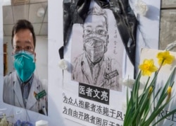 Chinese students and their supporters hold a memorial for Dr Li Wenliang, who was the whistleblower of the Coronavirus, Covid-19, that originated in Wuhan, China.