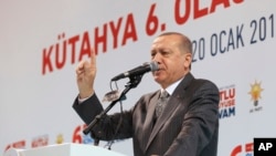 Turkey’s President Recep Tayyip Erdogan addresses his supporters in Kutahya, western Turkey, Saturday, Jan. 20, 2018. (Kayhan Ozer/Pool Photo via AP)
