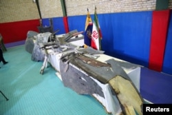 伊斯兰革命卫队2019年6月21日在伊朗德黑兰展示的声称为美国无人机的残骸。