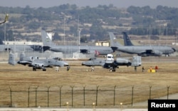 FILE - U.S. Air Force A-10 Thunderbolt II fighter jets (foreground) are pictured at Incirlik airbase in the southern city of Adana, Turkey.