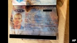 This undated photo, provided by the Las Vegas Police Department, shows a passport belonging to Matthew Livelsberger, found inside a Tesla Cybertruck involved in an explosion outside the Trump Hotel in Las Vegas.