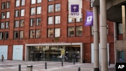 Few pedestrians are seen near an NYU building in New York, Dec. 16, 2021. 