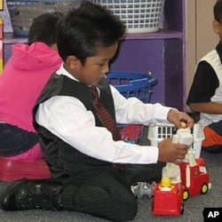 Families send their children to school in their best clothes, which doesn't stop them from playing
