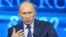 Russian President Vladimir Putin takes questions as part of a live broadcast in Moscow, April 25, 2013. 