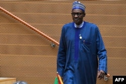 Nigeria's President Muhammadu Buhari walks after speaking at the opening of the Ordinary Session of the Assembly of Heads of State and Government during the 30th annual African Union summit in Addis Ababa, Jan. 28, 2018.