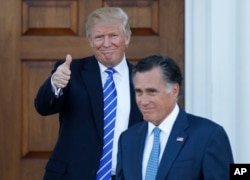 President-elect Donald Trump gives the thumbs-up as Mitt Romney leaves Trump National Golf Club Bedminster in Bedminster, N.J., Nov. 19, 2016.