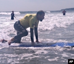 Stricken with polio at an early age, Brian Foss, 57, uses crutches but still enjoys skiing, bicycling and surfing.