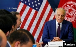 FILE - U.S. special envoy to Afghanistan Zalmay Khalilzad talks with local reporters at the U.S. Embassy in Kabul, Afghanistan, Nov. 18, 2018. (U.S Embassy handout via Reuters)
