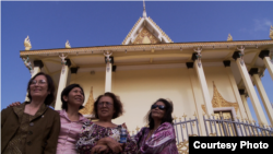 The three survivors, along with a Cambodian American professor Leakhena Nov, at the temple. (Courtesy Photo​ of Michael Siv)