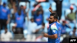 India's Mohammed Shami celebrates after taking the wicket of Bangladesh's Mehidy Hasan Miraz during the ICC Champions Trophy one-day international (ODI) cricket match between Bangladesh and India at the Dubai International Stadium in Dubai on February 20,