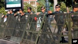 Riot police stand guard at a blocked street outside the Supreme Court in Phnom Penh, Cambodia, Nov. 16, 2017.