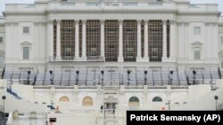  Preparations take place for President-elect Joe Biden's inauguration on the West Front of the U.S. Capitol in Washington, Friday, Jan. 8, 2021, after supporters of President Donald Trump stormed the building. (AP Photo/Patrick Semansky).