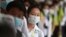 In this photo taken on Jan. 28, 2020, Cambodian students line up to sanitize their hands to avoid the contact of coronavirus before their morning class at a high school in Phnom Penh, Cambodia.