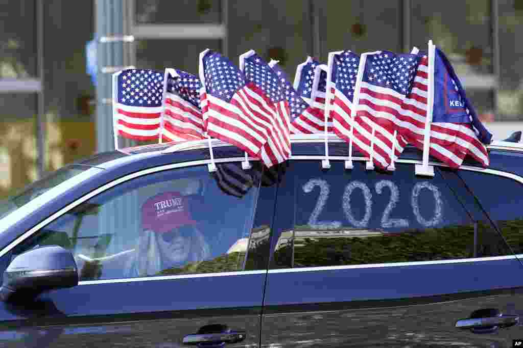 A protester joins a caravan outside of City Hall in Los Angeles. Demonstrators, supporting President Donald Trump, are gathering in various parts of Southern California as Congress debates to affirm President-elect Joe Biden's&nbsp;electoral victory.