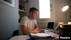 Lawyer Timon Karamanos, 40, works from home, following the coronavirus disease (COVID-19) outbreak, in Athens, Greece, June 24, 2020