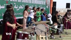 Jinên Kurd li Taxa Şêx Meqsûd ya Helebê Roja Jinan Pîroz Dikin