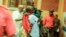In this image taken from video, people assist victims after two explosions hit a rally of M23 rebel group leaders and residents in Bukavu, Democratic Republic of Congo, on Feb. 27, 2025.