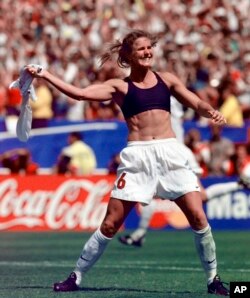 FILE - In this July 10, 1999, file photo, the United States' Brandi Chastain celebrates by taking off her jersey after kicking in the game-winning goal in penalty shootout goal against China in the FIFA Women's World Cup Final.