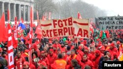 File - Workers and trade union representatives from all over Europe hold a demonstration against austerity near the European Commission and Council headquarters in Brussels, March 2013.
