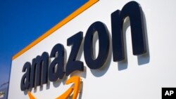 FILE - In this April 16, 2020, photo, the Amazon logo is seen in Douai, northern France. 