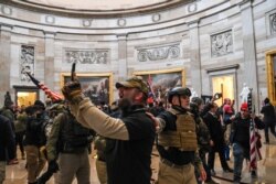 Supporters of US President Donald Trump enter the US Capitol's Rotunda on January 6, 2021