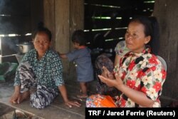 Rorn Chhang (right) and her sister, Sorum Chhang, speak about their opposition to a protected forest near their village of Ta Bos, Preah Vihear province, Cambodia, May 17, 2018.