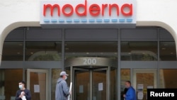 FILE - A sign marks the headquarters of Moderna which is developing a vaccine against the coronavirus, in Cambridge, Massachusetts, U.S., May 18, 2020. The company now has four people on the 2021 Forbes billionaires list. (REUTERS/Brian Snyder/File Photo)