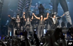 Gene Simmons, left, Eric Singer, Paul Stanley and Tommy Thayer of KISS take a bow during the final night of the "Kiss Farewell Tour," Saturday, Dec. 2, 2023, at Madison Square Garden in New York. (Photo by Evan Agostini/Invision/AP)