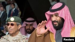 FILE - Saudi Arabia's Crown Prince Mohammed bin Salman gestures during the graduation ceremony of the 93rd batch of the cadets of King Faisal Air Academy, in Riyadh, Feb. 21, 2018. (Reuters)