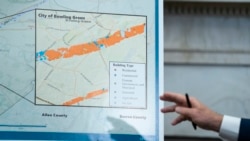 President Joe Biden points to a chart showing the path of tornado damage as he talks to reporters after receiving a briefing with Homeland Security Secretary Alejandro Mayorkas on the federal response to tornado damage, in the White House."