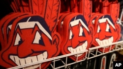 Foam images of the MLB baseball Cleveland Indians' mascot Chief Wahoo are displayed for sale at the Indians' team shop in Cleveland, Jan. 29, 2018. 