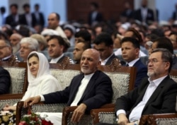 FILE - Afghan presidential candidate Ashraf Ghani, center, attends the first day of campaigning in Kabul, Afghanistan, July 28, 2019.