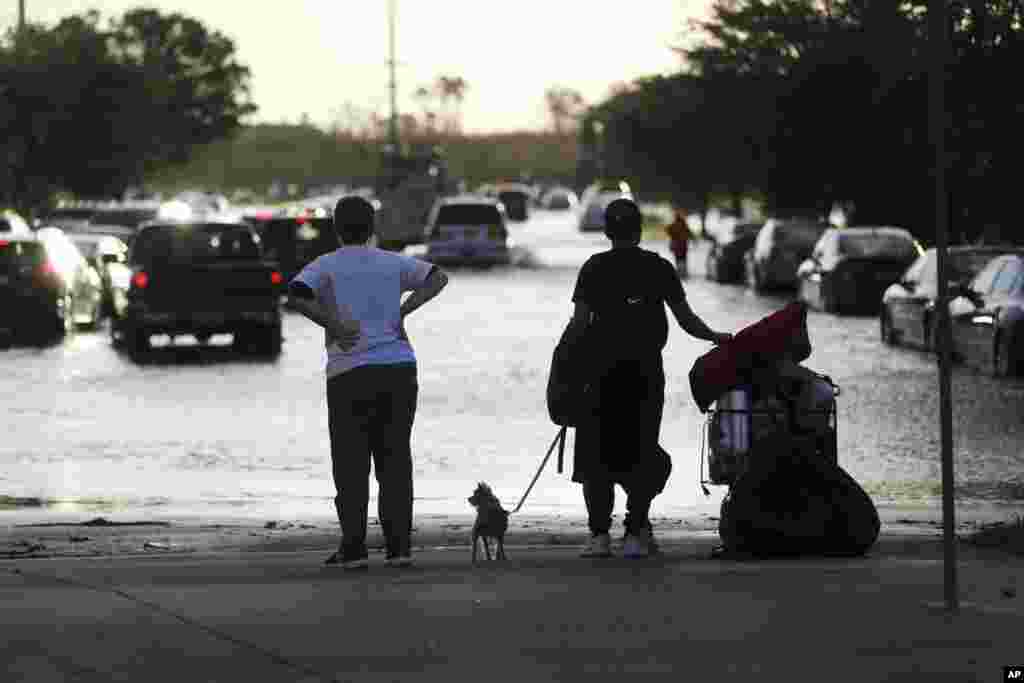 Evacuees leave the Germain Arena, which was used as an evacuation shelter for Hurricane Irma, in Estero, Florida, Sept. 11, 2017.