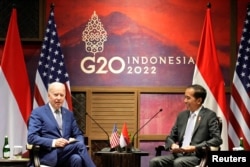 U.S. President Joe Biden, left, talks with Indonesian President Joko Widodo during their bilateral meeting ahead of the G20 Summit in Nusa Dua, Bali, Nov. 14, 2022.