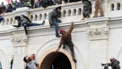 Supporters of U.S. President Donald Trump climb on walls at the U.S. Capitol during a protest against the certification of the 2020 U.S. presidential election results by the U.S. Congress, in Washington, U.S., January 6, 2021. REUTERS/Stephanie Keith