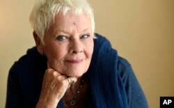 FILE - Judi Dench poses for a portrait during the Toronto International Film Festival in Toronto, Sept. 11, 2017.