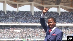 Zambia President Inaugurated: President Edgar Lungu of Zambia, waves to the crowd during his inauguration in Lusaka, Zambia, Tuesday, Sept. 13, 2016. 