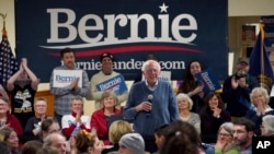 FILE - Democratic presidential candidate Sen. Bernie Sanders, I-Vt., smiles as he listens to a question from the audience during a campaign stop, Nov. 24, 2019, in Hillsboro, N.H.
